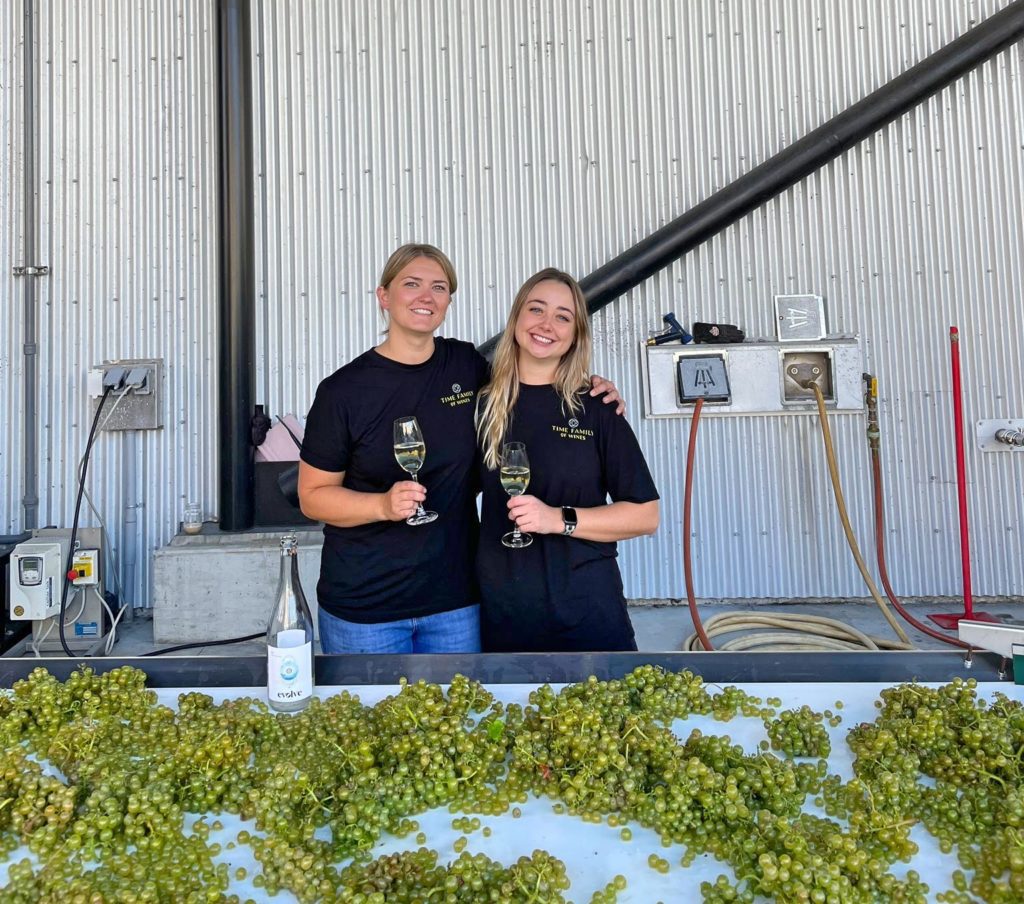 Winemaker Lynzee Schatz with lead cellar hand Maja Syska on the right with harvested Ortega grapes.