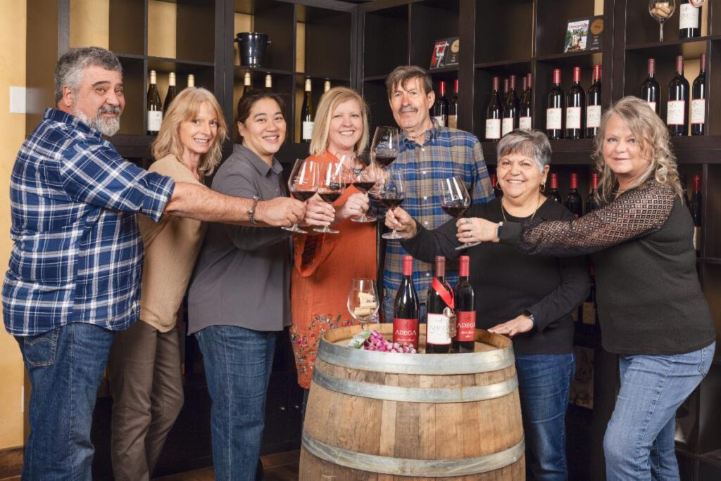 The Adega on 45th previous owners and new owners Gate 22 Winery team celebrate. Photo credit Best Ever Studio L:R Fred Farinha, Pamala Farinha, Karen Yeung, Christa-Lee McWatters, Alex Nunes, Maria Nunes, Karen Valckx